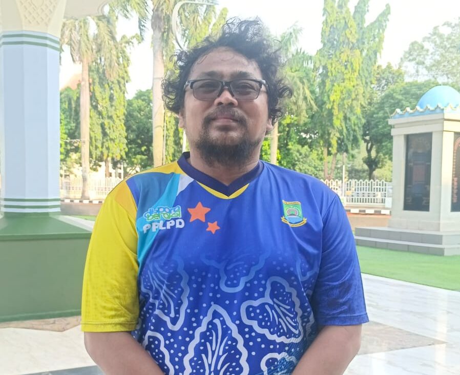 Pelatih cabor angkat besi POPDA XI Banten Kota Tangerang, Erwin Lamhot Siregar